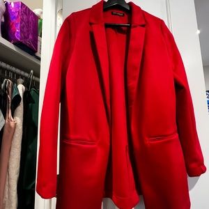 Long red blazer with black strips on the side